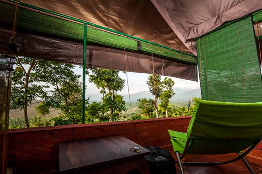 Relaxing-chair-with-a-beautiful-view-at-Night-view-of-Luxury Tent Stay At Pozuthana